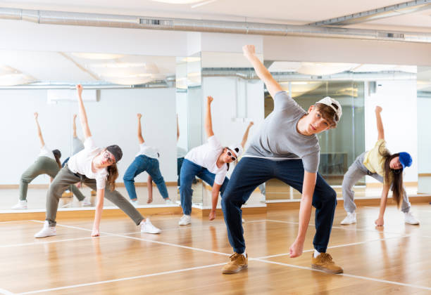 istock Happy positive teenagers learn dance movements 1276399875