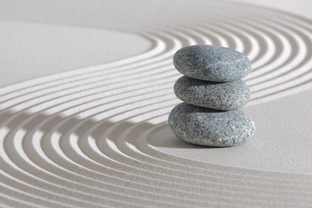 istock Japanese ZEN garden with stone in textured sand 1276399877