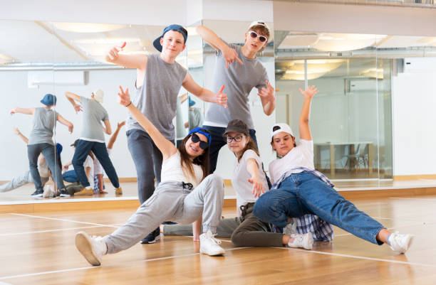 istock Group of dancing teenagers posing in dance studio 1276400023