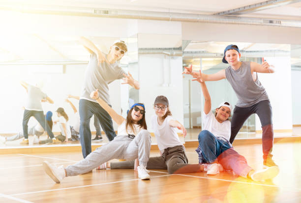 istock Teens hip hop dancers posing in studio 1276400429