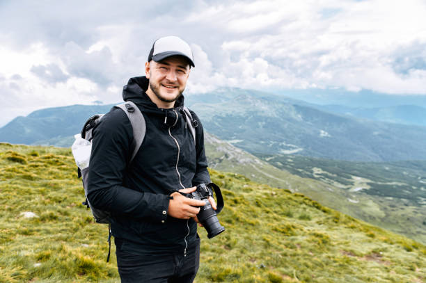 istock Male hiker with a backpack in mountains 1276400832