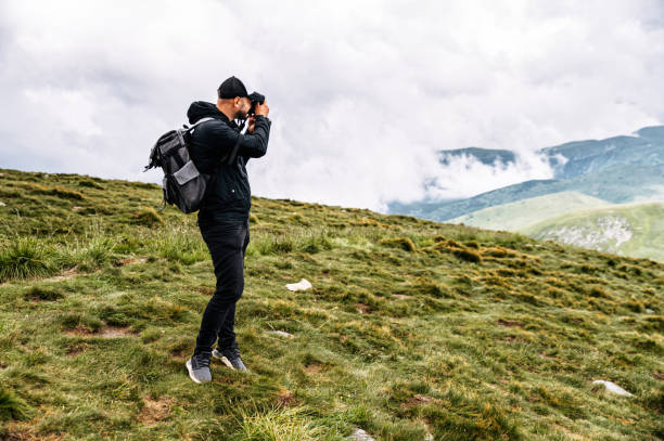 istock Male hiker with a backpack in mountains 1276400919