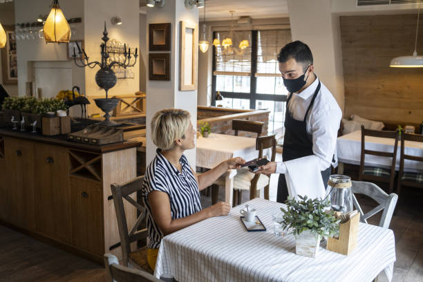 istock Attractive female is visiting a restaurant after Covid-19 lockdown 1276401326