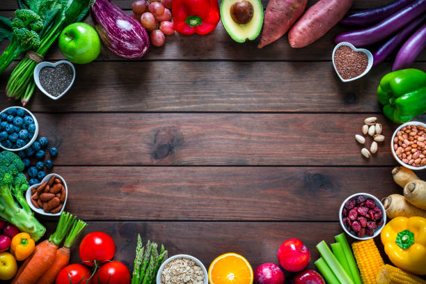 istock Vegan frame on brown wooden table 1276402846