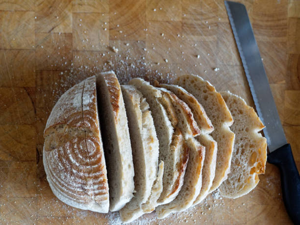 istock A sliced loaf of sourdough bread on a chopping board in a rustic kitchen 1276403779