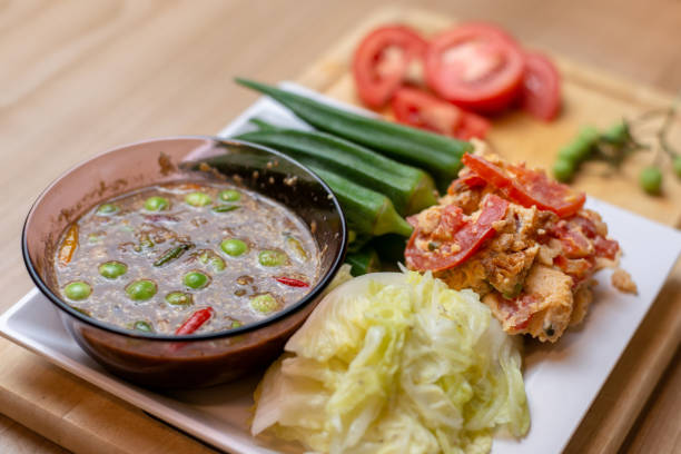 istock Thai shrimp paste chili dip eat with fresh vegetable and omelet 1276404046