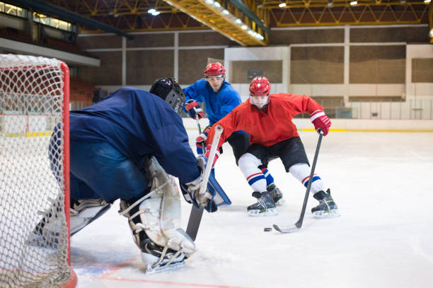 istock Hockey players playing ice hockey 1276407689