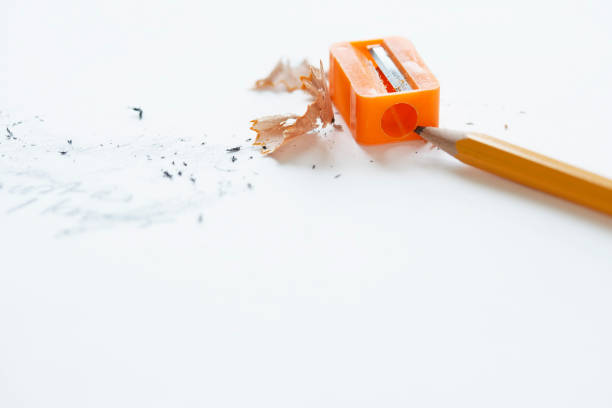 istock Orange pencil with orange pencil sharpener and shavings 1276407933