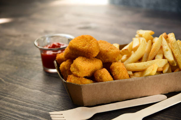 istock Chicken nuggets and frie 1276408248