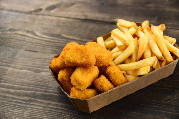 istock Chicken nuggets and frie 1276408266