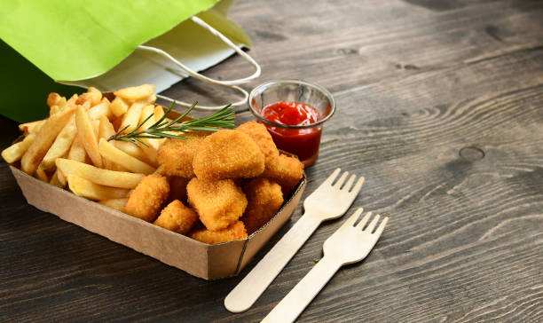 istock Chicken nuggets and frie 1276408318