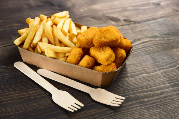 istock Chicken nuggets and frie 1276408344