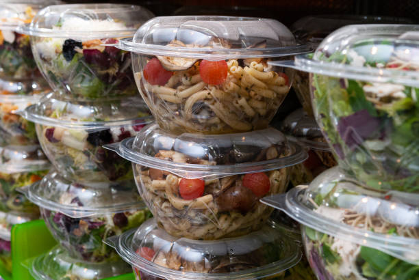 Closeup shot of tasty food in plastic containers in the shop stock photo