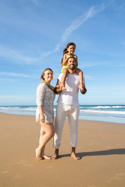 istock Joyful parents and child wearing summer clothes 1276409308