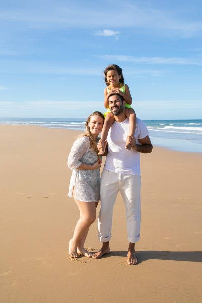 istock Cheerful parents and child wearing summer clothes 1276409740