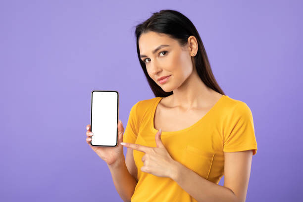istock Woman showing white blank cell phone screen 1276412717