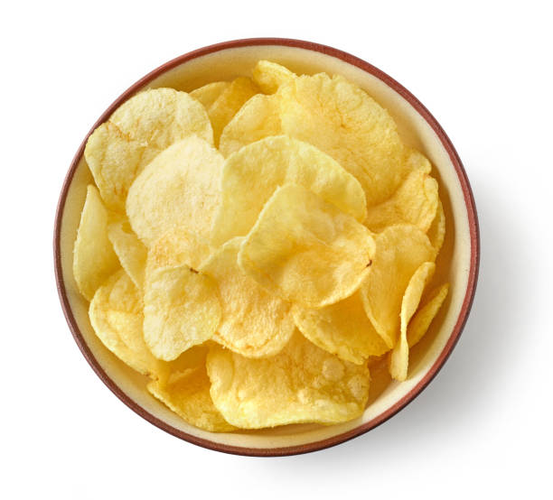 bowl of potato chips bowl of potato chips isolated on white background, top view potato chip photos stock pictures, royalty-free photos & images
