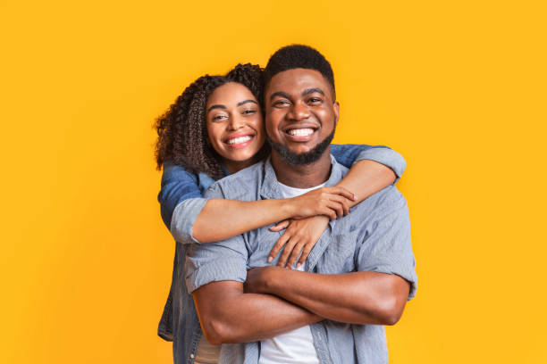 happy in relationship. portrait of smiling black girl and her handsome boyfriend - couple black imagens e fotografias de stock