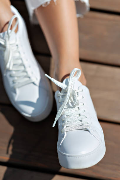 istock White shoes with white laces. 1276419596