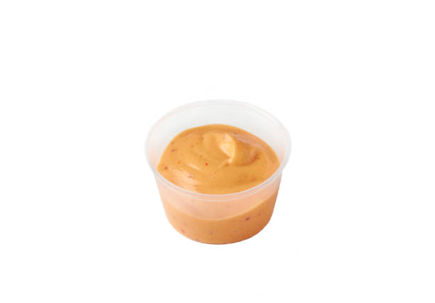 istock spicy sauce in a plastic container on an isolated white background 1276421561