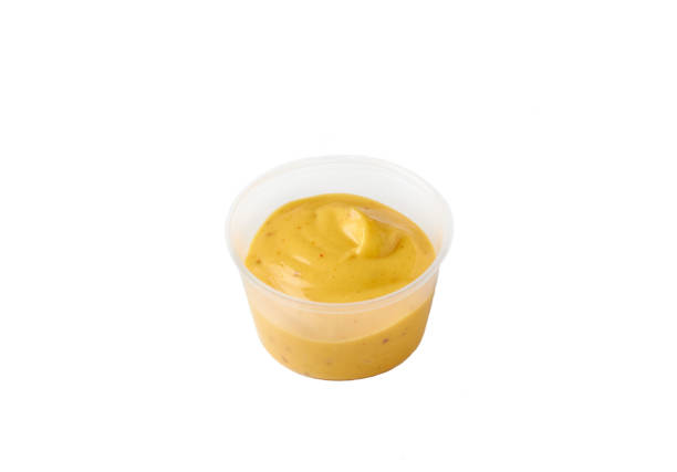istock mustard sauce in a plastic container on an isolated white background 1276421569