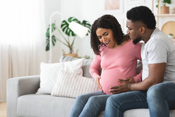 istock Black woman suffering from labor pains at home 1276424135