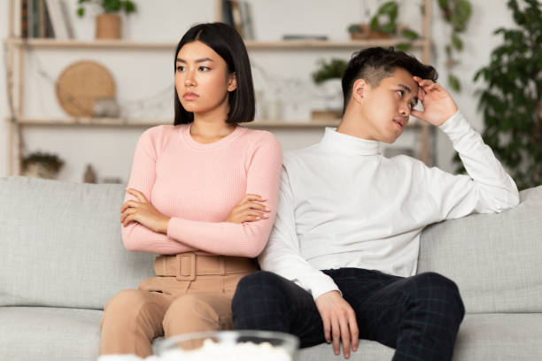 Asian Couple After Quarrel Not Talking Sitting Offended At Home Asian Couple After Quarrel Sitting Offended Not Talking To Each Other Having Relationship Problems At Home. Spouses After Family Conflict, Breakup, Relationship Crisis Concept arguing stock pictures, royalty-free photos & images