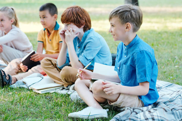 istock Curious kids at outdoor lesson 1276426472