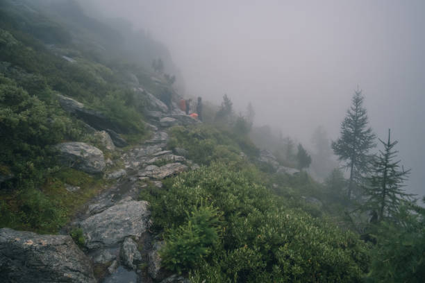 istock Tourists hiking in Alps 1276426671