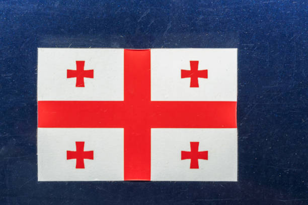 istock Georgian flag on a dark blue background close up 1276427101