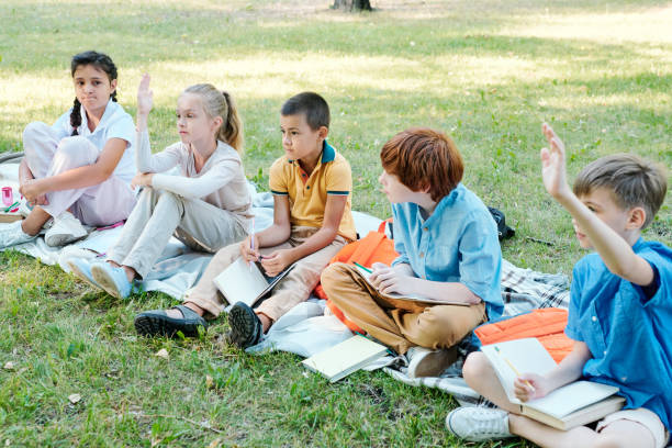 istock Schoolchildren answering teachers question 1276427818