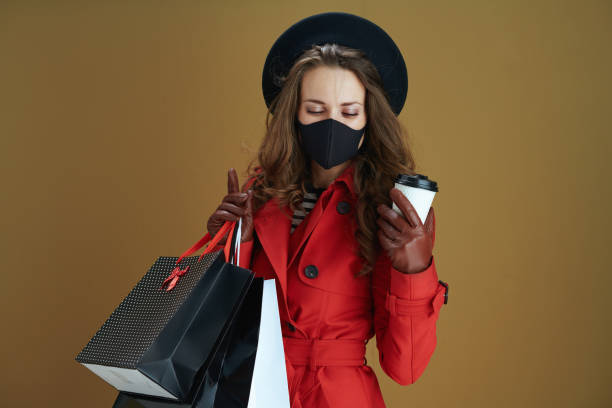 istock relaxed woman in coat against bronze background 1276428458