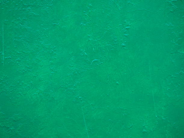 istock Cement wall painted in bright green. 1276430097