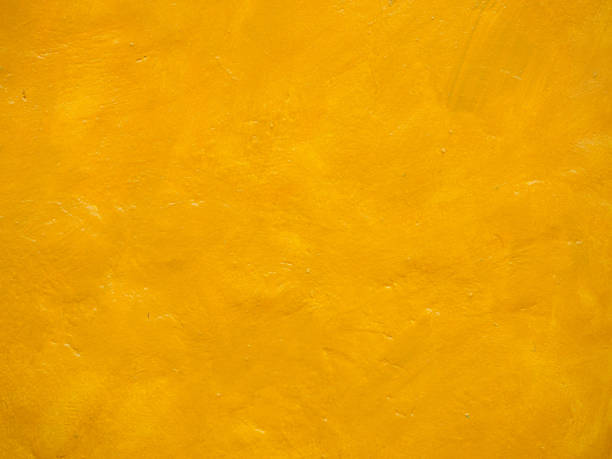 istock The cement wall is painted bright yellow. 1276430103