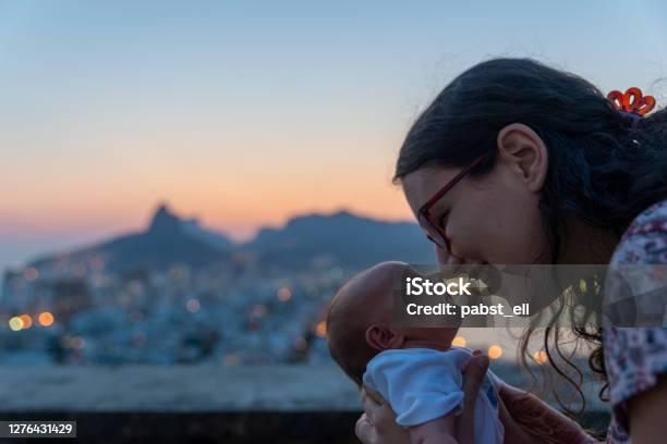 Mother Rubbing Nose With Baby Daughter Rio De Janeiro Stock Photo - Download Image Now