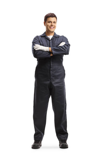 istock Auto mechanic worker in a navy blue uniform posing with crossed arms 1276432406