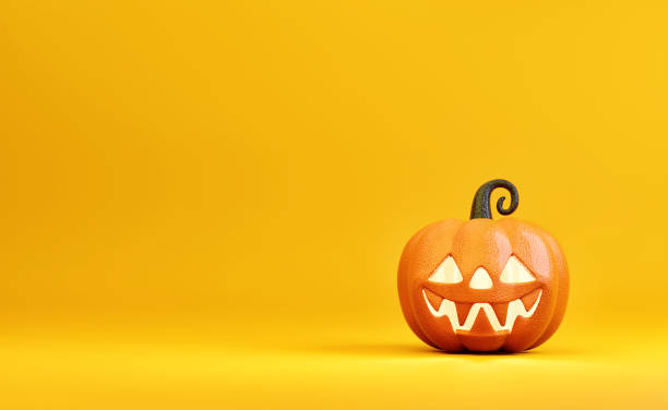 istock Halloween pumpkin character decorations on a yellow-orange background. 1276432575