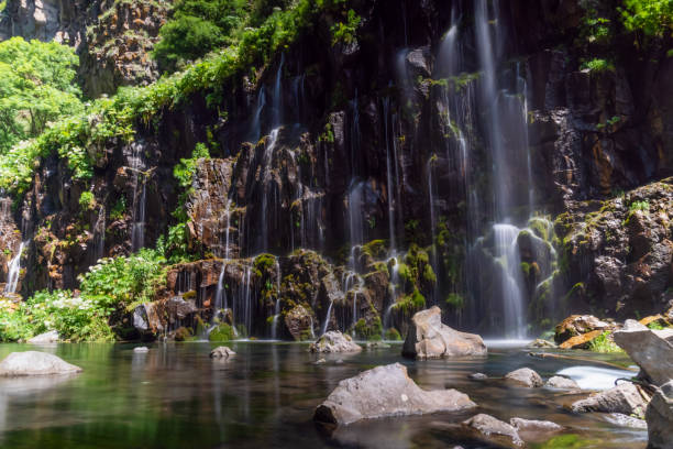 istock Dashbashi canyon, waterfalls and Khrami river in Tsalka district, Georgia. Beautiful waterfall on a sunny day among the green 1276432664