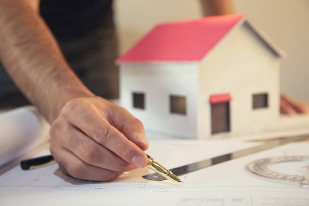 istock architect hands working on blueprint inspection in workplace 1276433890