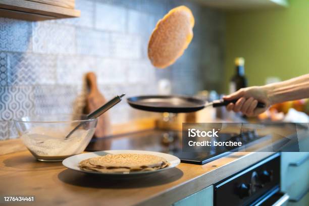 Making Pancakes Stock Photo - Download Image Now - Pancake, Throwing, Preparation