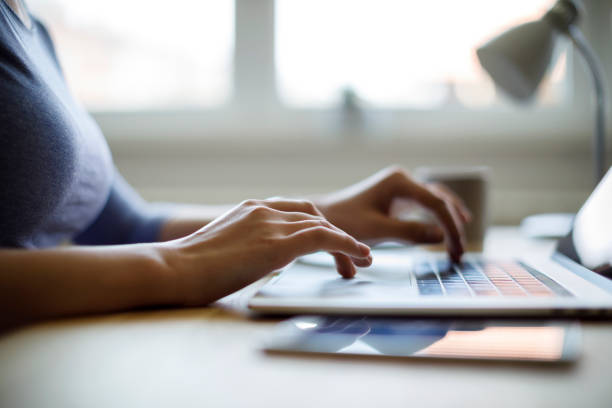 istock Woman using her laptop for working from home 1276435282