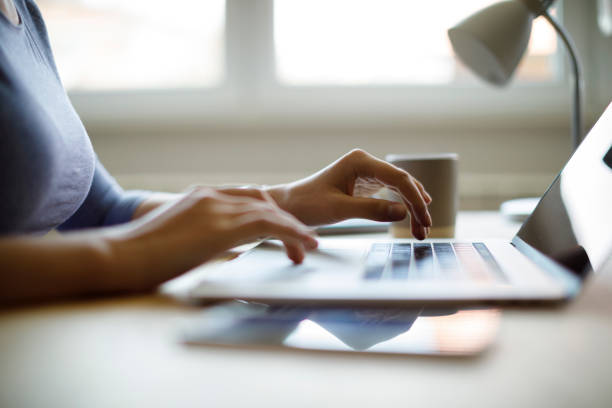 istock Woman using her laptop for working from home 1276435383