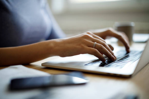istock Woman using her laptop for working from home 1276435468