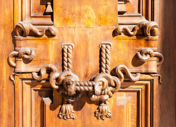 istock Beautiful wooden door with snake decor. 1276435635