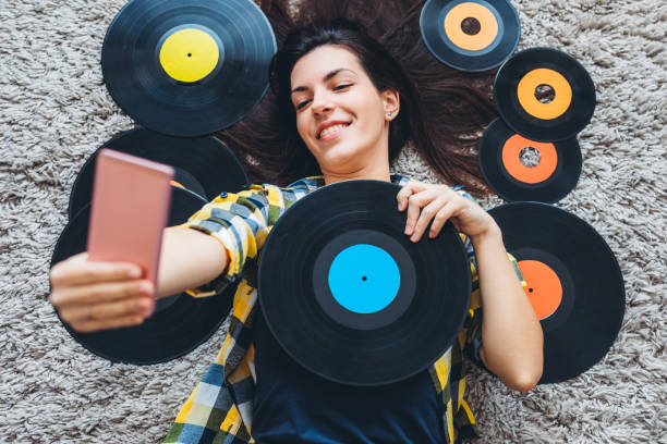 istock Listening to old records and taking selfie 1276436004