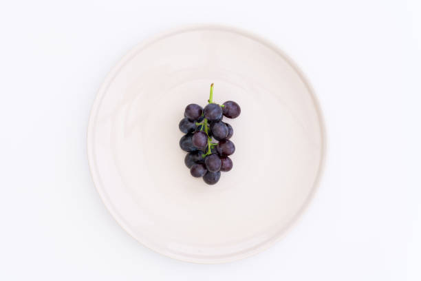Purple grapes on the plate