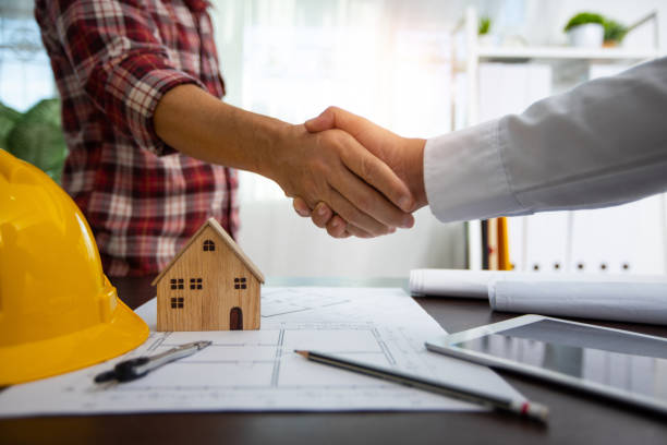 istock Handshake of builder, engineer with architecture after successful discussing and planning, partner and teamwork concept 1276436999