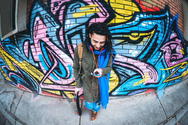 istock Young man with dreadlocks enjoys music 1276437449
