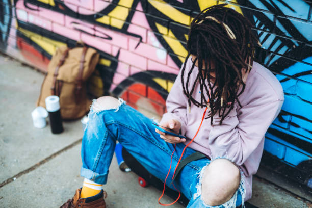istock Graffiti artist listens to music 1276437646