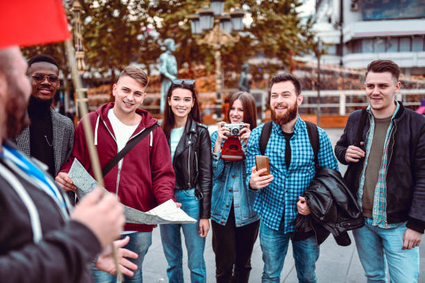 Tourist Group And Guide Making Plan For Sightseeing City
